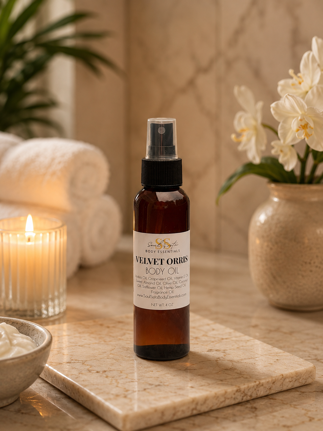 SoulsistaBodyEssentials body oil bottle with a clear liquid, featuring a minimalist label, on a neutral background.